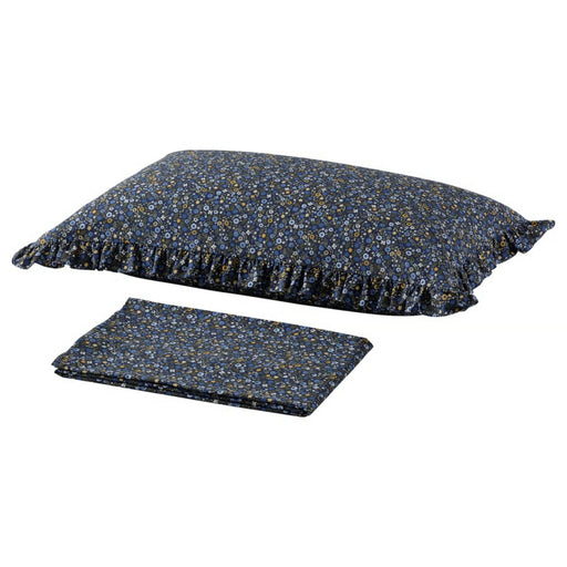 Floral-patterned pillow and blanket set on a white background