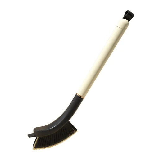 Cleaning brush with black bristles and beige handle on a white background