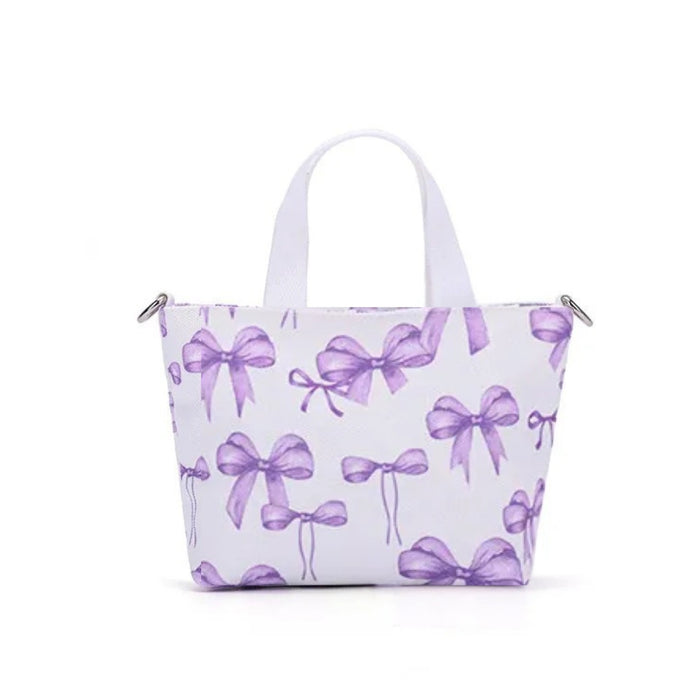 Canvas Shoulder Bag – Purple Bow Print, 15×6.5×13.5cm Fashion Tote, displayed upright with twin white handles