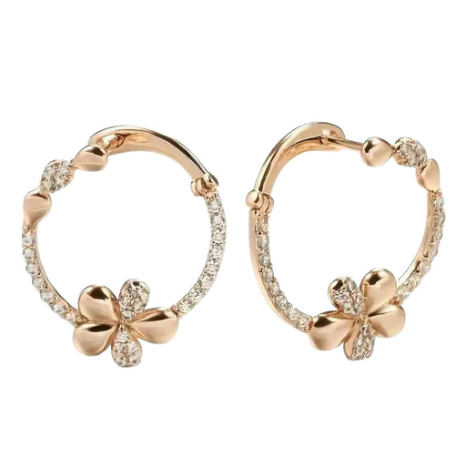 Rose gold hoop earrings with clover designs on a white background