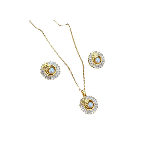 Gold necklace and earrings set on a white background
