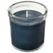 Dark blue candle in a clear glass jar on a white background