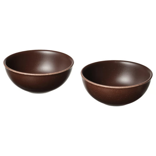 Two brown ceramic bowls on a white background