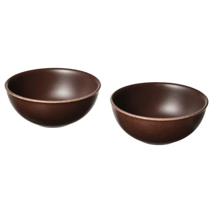 Two brown ceramic bowls on a white background