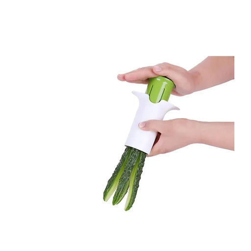 Hand holding a green vegetable peeler with cucumbers on a white background