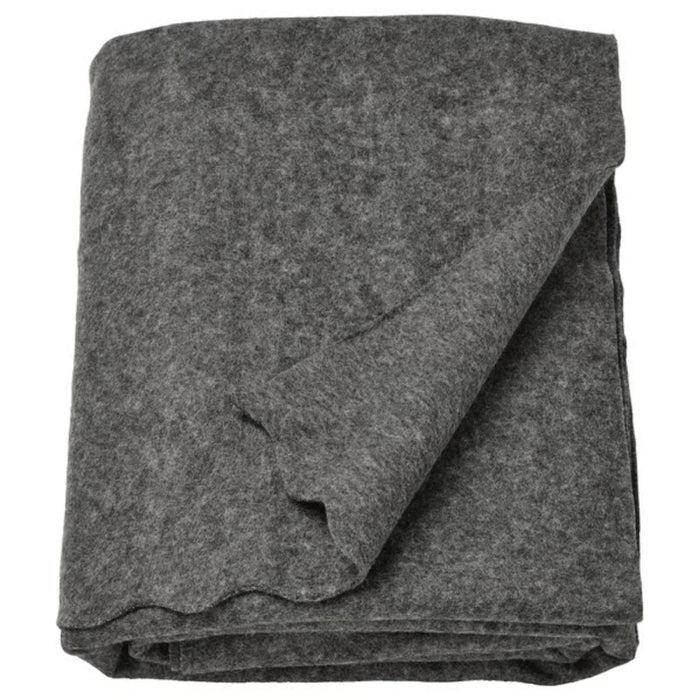 DAGGKÅPOR throw, dark grey, 130x170 cm. Soft textured fabric shown folded with lifted corner to reveal thickness – ideal for sofa or bed layering – 50598643.