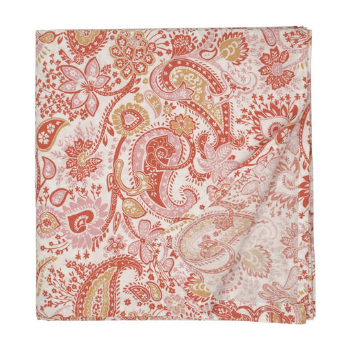 Floral and paisley patterned fabric swatch in red and beige on a white background