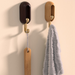 Sturdy brown adhesive hooks for hanging coats, towels, and decor without nails