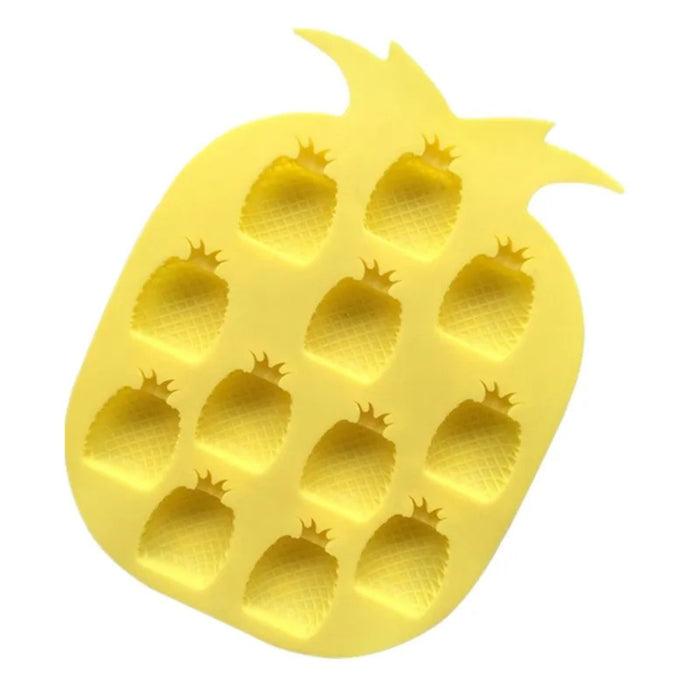 Yellow pineapple-shaped ice cube tray on a white background