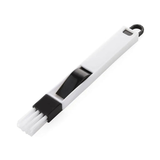 White brush with black handle on a white background
