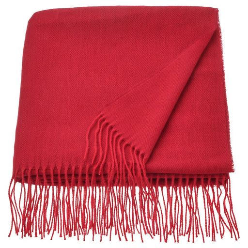 Folded IKEA VINTERFINT red throw with long fringes, showcasing its soft texture and vibrant festive color