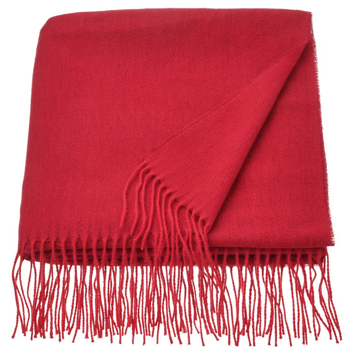 Folded IKEA VINTERFINT red throw with long fringes, showcasing its soft texture and vibrant festive color