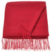 Folded IKEA VINTERFINT red throw with long fringes, showcasing its soft texture and vibrant festive color