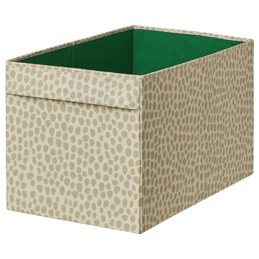 Fabric storage box with beige pattern and green interior on a white background