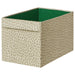 Fabric storage box with beige pattern and green interior on a white background