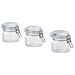 Three clear glass jars with metal clamps on a white background