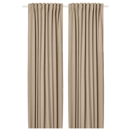 Pair of beige curtains on a white background