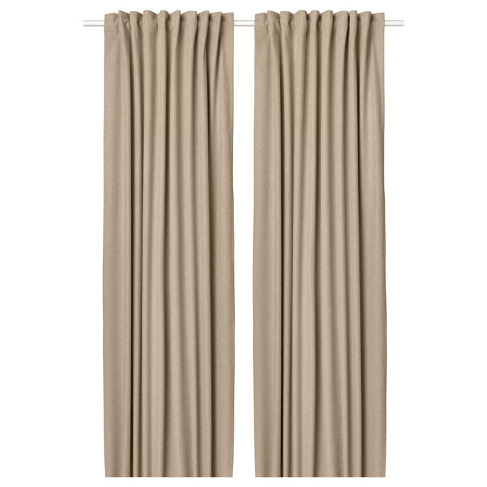 Pair of beige curtains on a white background