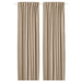 Pair of beige curtains on a white background
