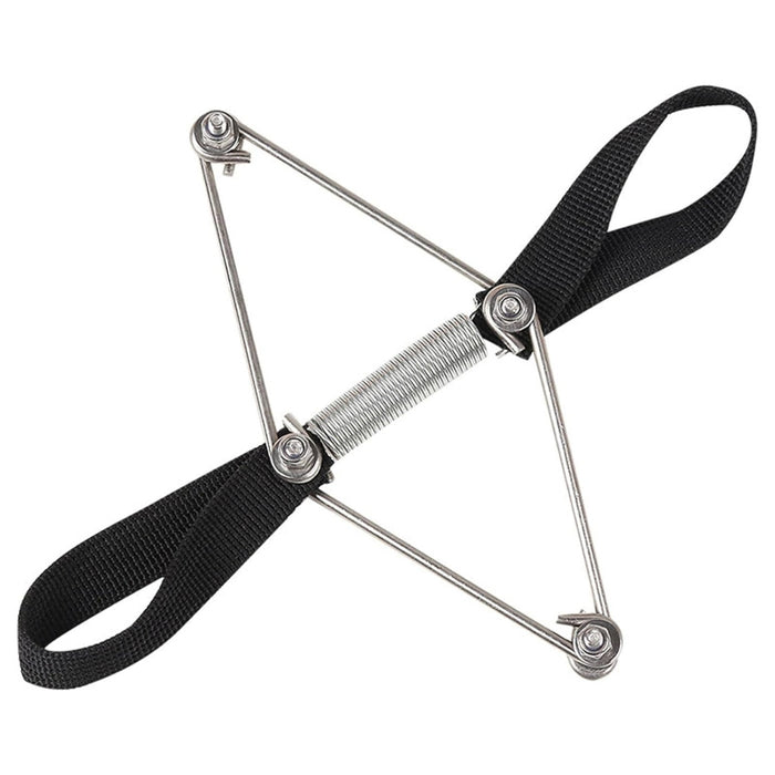 Close-up of a stainless steel elastic toe tension band with black adjustable fabric straps for bunion correction.