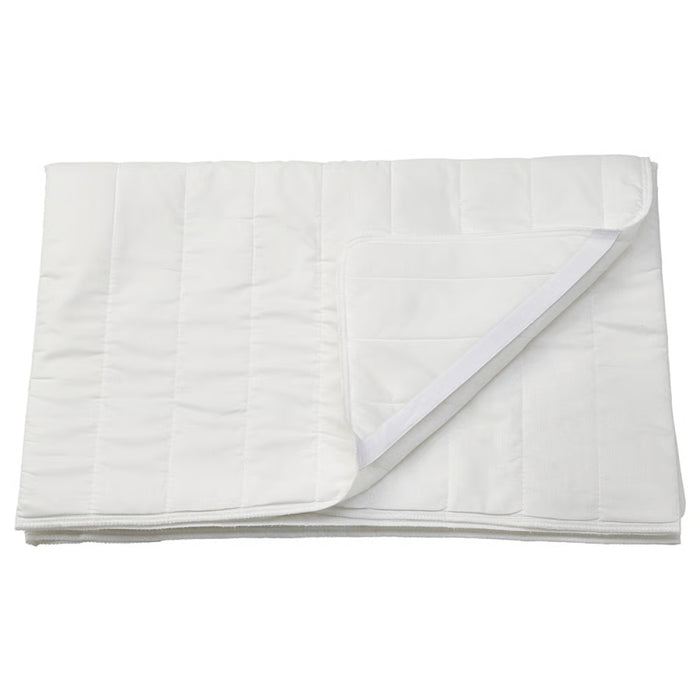 White quilted cover on a white background