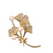 Gold brooch with leaves and pearls on a white background