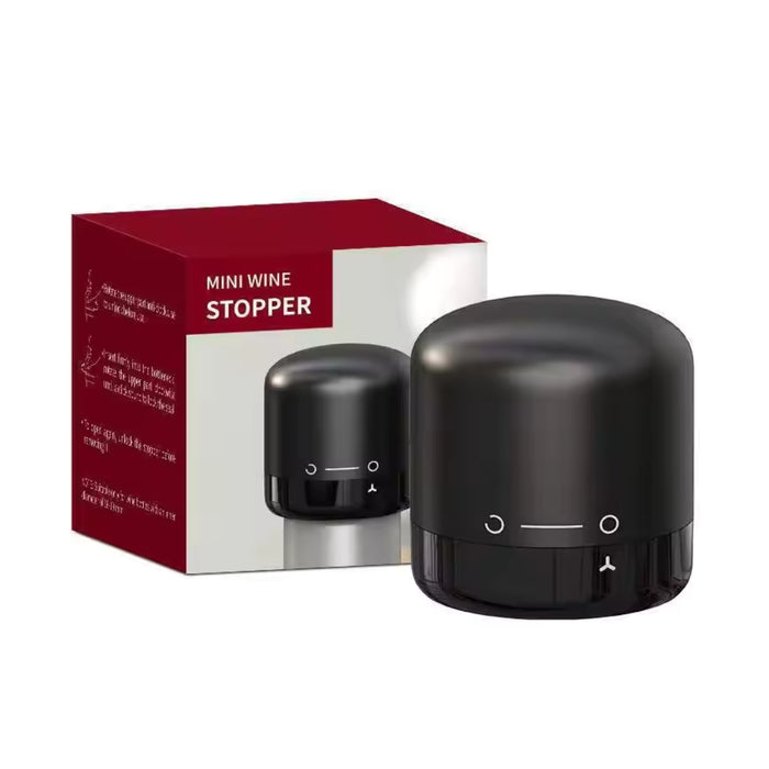 A black mini wine stopper device shown next to its red and white retail box on a plain white background.
