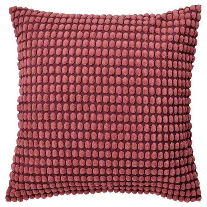 SVARTPOPPEL cushion cover, light red, 65x65 cm – textured surface with raised dot pattern, placed on beige sofa with pink pillow and white vase in cozy living room – 90543026.