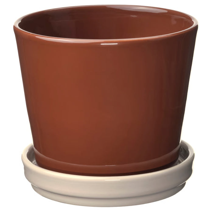 “Small plant pot with matching saucer, 12 cm, in red-brown light beige finish, suitable for indoor and outdoor use.”

