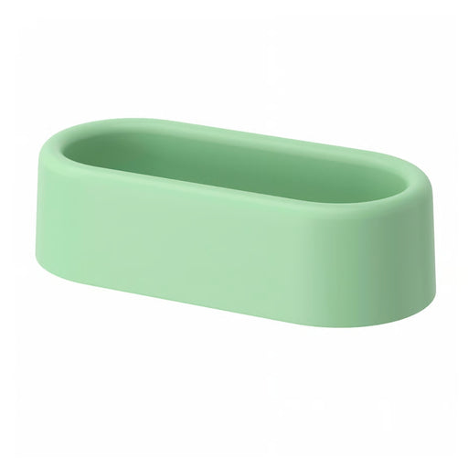 HUMLESJÖN basket mounted on tiled bathroom wall, holding toothbrushes and a small cup.

