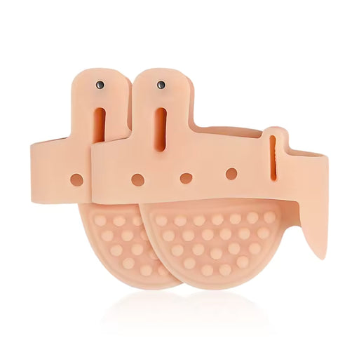 Pair of beige silicone foot pads with a white background