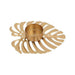 Gold decorative candle holder with leaf-like design on a white background