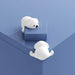 Two white silicone corner guards shaped like adorable cartoon puppies are attached to the corner of a blue surface—one on the top and one on the side. Their soft, rounded design adds charm while providing child-safe edge protection. Ideal for homes with toddlers, these guards serve both as safety tools and playful décor accents -1600001888980 13025258.