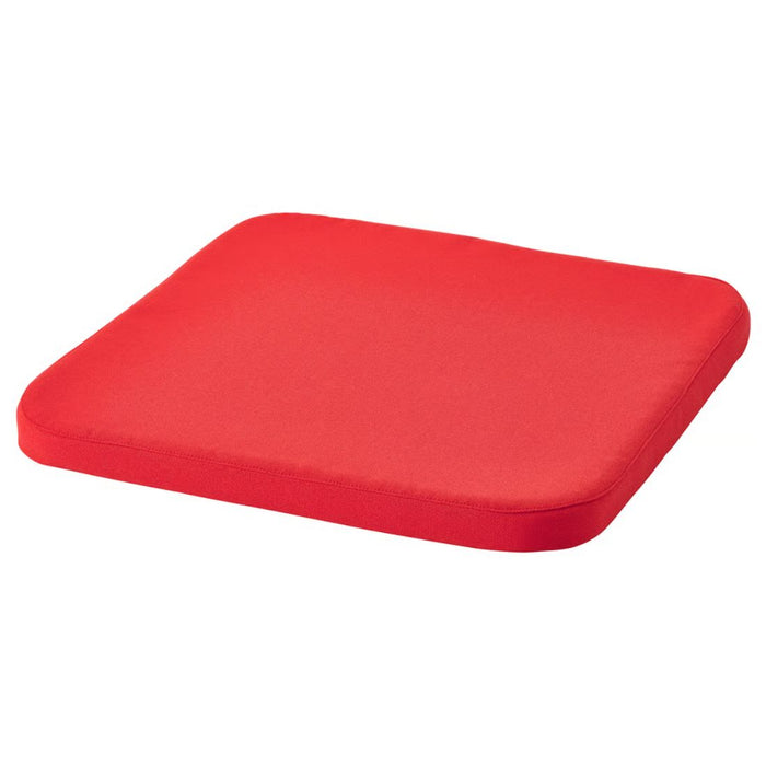 IKEA STAGGSTARR chair pad in solid red with rounded corners, shown flat against white background