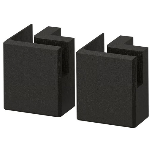 Two black corner protectors on a white background