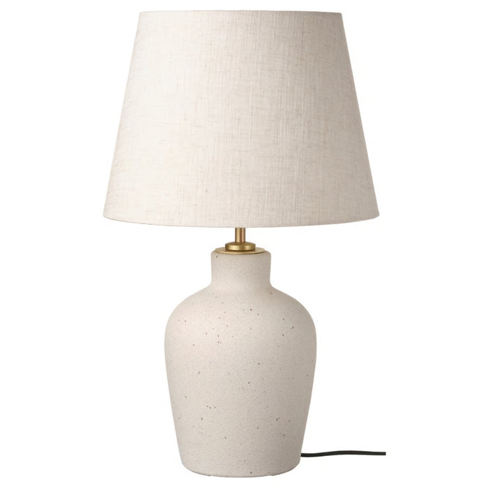 Off-white ceramic table lamp with a beige textile shade, 50 cm tall, featuring a rounded ceramic base and brass-toned lamp holder.

