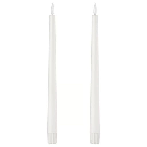 Pair of IKEA SMÅLOM LED taper candles in white with ribbed bases and flame-shaped tips, shown unlit against plain background