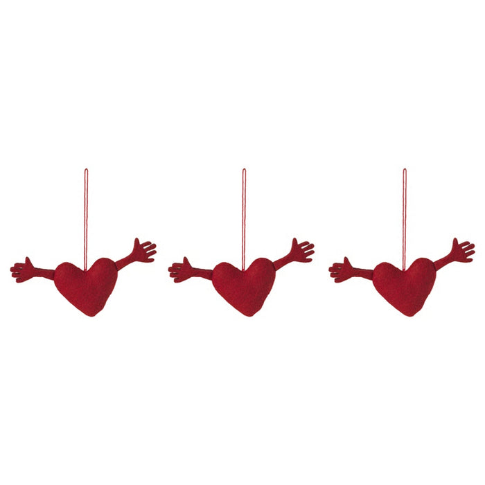 Set of three IKEA VINTERFINT heart-shaped red ornaments with outstretched arms, suspended by red strings against white background