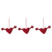 Set of three IKEA VINTERFINT heart-shaped red ornaments with outstretched arms, suspended by red strings against white background