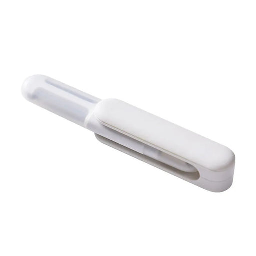 White plastic clip on a white background