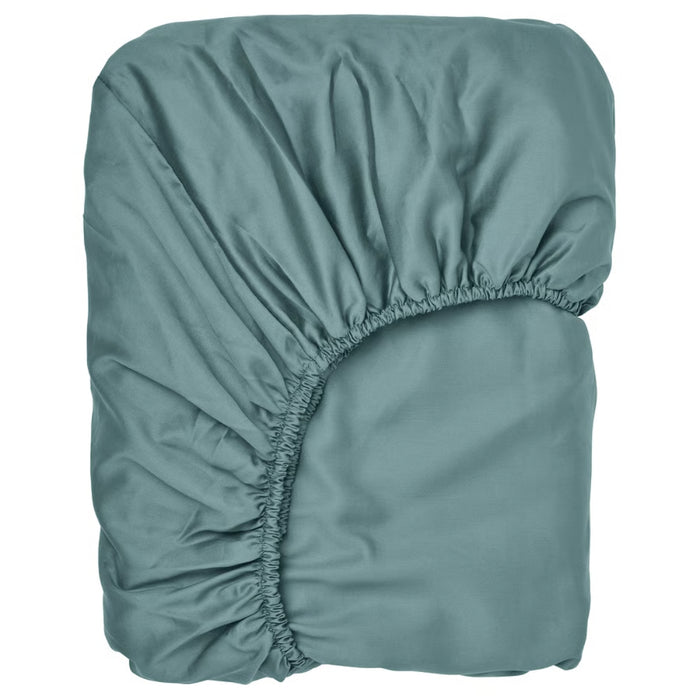 Teal fitted sheet on a white background