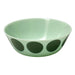 Green bowl with black polka dots on a white background