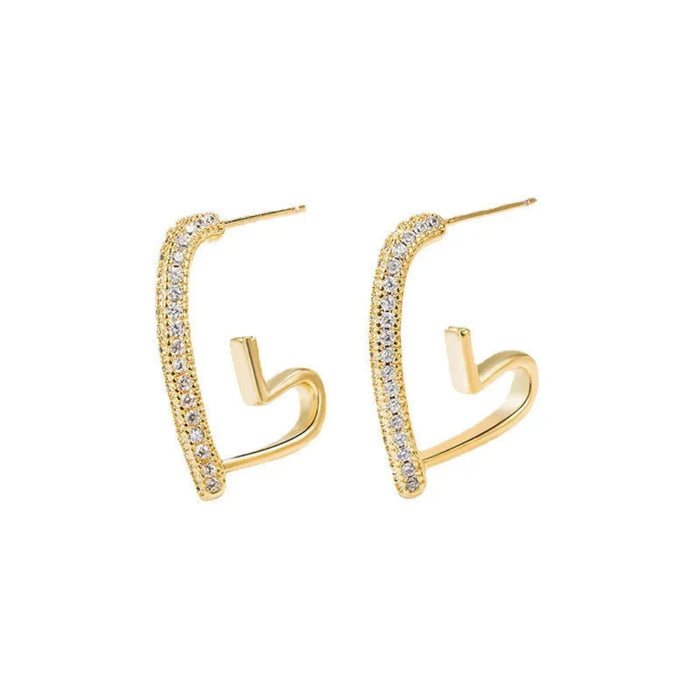 Gold hoop earrings with clear gemstones on a white background