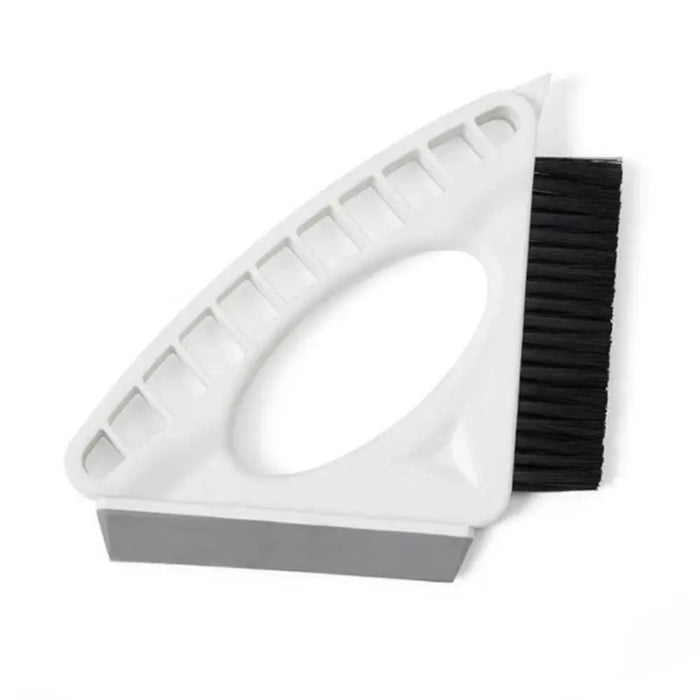 Cleaning tool with white base, black bristle brush, and gray rubber edge on a white background