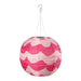 Pink and white patterned paper lantern hanging on a white background