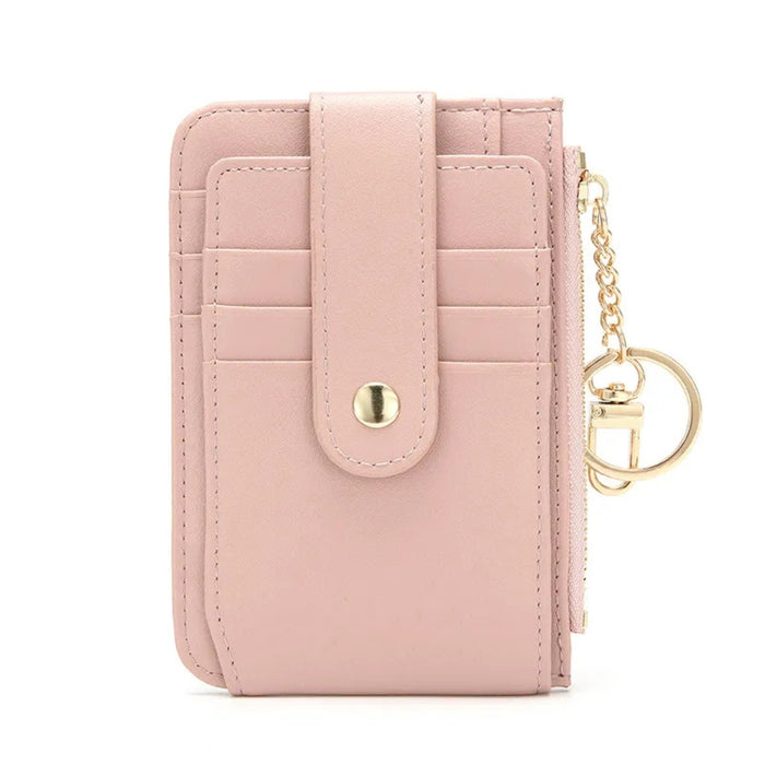Pink wallet with a keychain on a white background