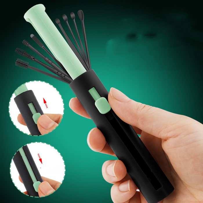 Hand holding a black and green hairbrush with close-up insets on a green background