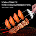Non-slip kebab forks securely holding meat and vegetables on grill