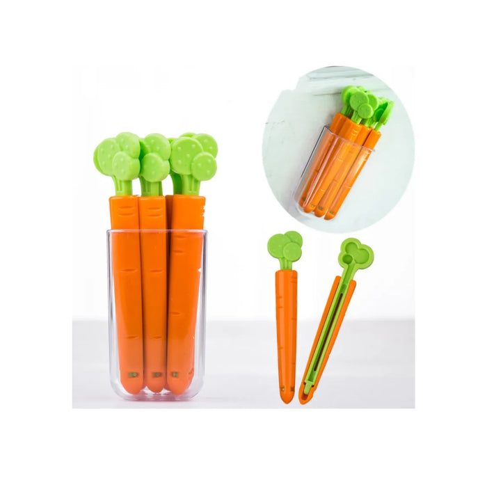 Carrot-shaped tools with green tops in a clear plastic container on a white background.