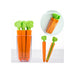 Carrot-shaped tools with green tops in a clear plastic container on a white background.